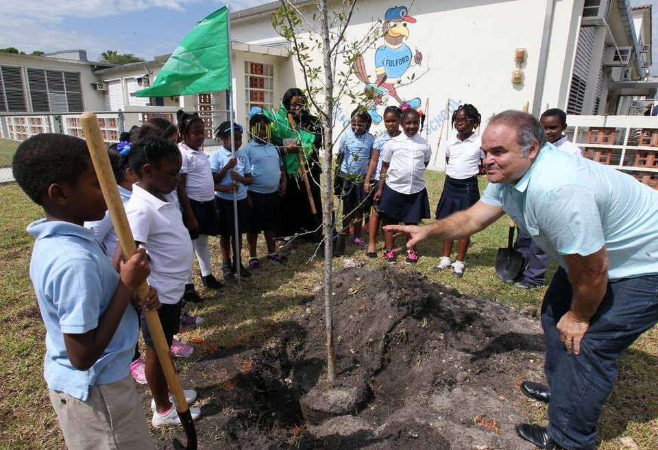 Artist Xavier Cortada helps students plant a live oak at Fulford Elementary School in North Miami Beach on Wednesday, April 22, 2015. ROBERTO KOLTUN EL NUEVO HERALD Read more here: http://www.miamiherald.com/news/local/education/article19248147.html#storylink=cpy