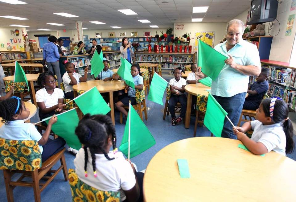 Artist Xavier Cortada talks to students about Earth Day flags. ROBERTO KOLTUN EL NUEVO HERALD Read more here: http://www.miamiherald.com/news/local/education/article19248147.html#storylink=cpy