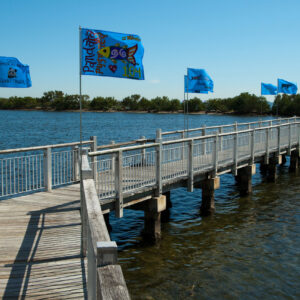 Xavier Cortada, "Endangered World: Biscayne National Park," 360 individually painted flags flying along a mile-long site-specific participatory art installation at Biscayne National Park, 2010.