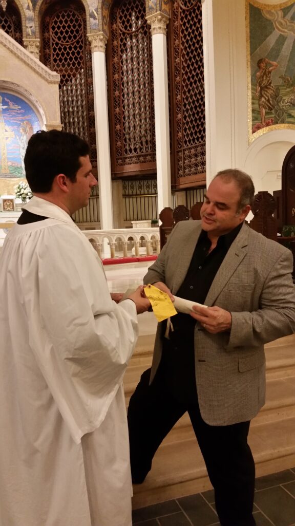 Cortada presents Fr. Grey Maggiano with water from Antarctica for South Pole Communion.